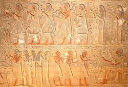 Ancient Egyptian hieroglyphics, stone carving reliefs with elegant women, historic Egypt