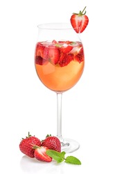 Drink with strawberries and mint in a wine glass