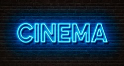 Neon sign on a brick wall - Cinema