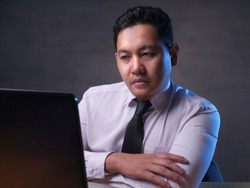 Portrait of Asian man Looked tired upset, depresssed and stressed looking at laptop, sleepy tired stress gesture, bad business pressure, work addict concept