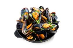 Delicious seafood mussels with  parsley sauce and lemon. isolated on white background