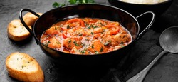Fish Stew cooked in a delicious  rich and fragrant broth, topped with fresh parsley and served with  rice.