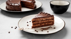 A slice of delicious chocolate cake.  Layered chocolate cake .