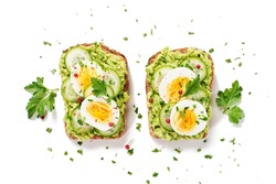 Healthy breakfast toast with avocado smash and boiled egg. isolated on white background, top view