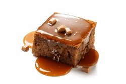 Easy Sticky Toffee Pudding is a deliciously gooey sponge cake drenched in warm toffee sauce that’s a favorite among the English. isolated on white background