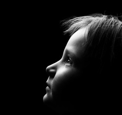 Profile of a child's face with high contrast light