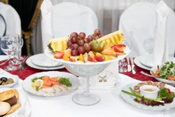 Dish with fresh fruit on the Banquet table in the restaurant