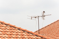 TV antenna on red roof