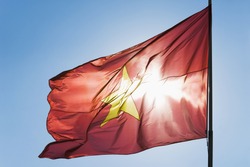 Vietnamese flag fluttering against the blue sky, Athens, Greece