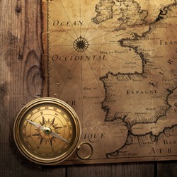 old compass on vintage map (France, Spain, England, Portugal, Holland, Denmark author Pierre Du Val (1618-1683) Paris. France 1666 )