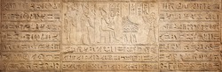 Old Egyptian hieroglyphs on an ancient background. Wide historical background. Ancient Egyptian hieroglyphs as a symbol of the history of the Earth. 