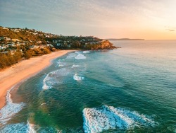 Sunrise sky morning aerial views in a northerly direction of Whale Beach Northern beaches Australia