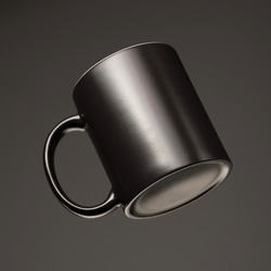 black mug mockup on black background.