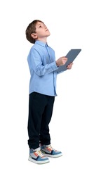 Boy kid dream and think, holding tablet in hands, isolated over white background. Concept of future career and education