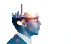 African American businessman wearing formal suit and glasses. New York city skyscraper panoramic view instead of man brain. White background. Concept of imagination, inspiration and megapolis