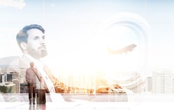 Business trip concept with businessman in airplane cabin on New York city background. Double exposure