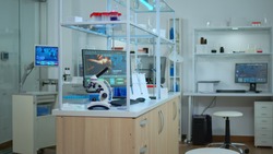 Empty laboratory modernly equipped with nobody in it, prepared for pharmaceutical innovation using high tech and microbiology tools for scientific research. Vaccine development against covid19 virus.