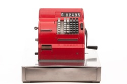 Vintage red cash register on white background