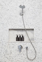shower on tile wall