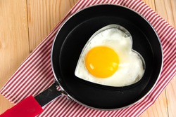Fried egg in heart shape 
