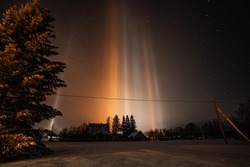 Light Pillars. Rare meteorological phenomena. Winter nature landscape.
