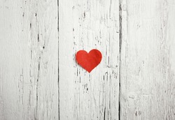 Heart on white wood background 