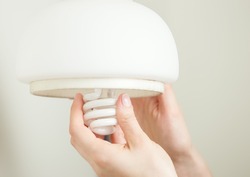 Installing energy efficient compact fluorescent light