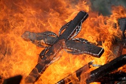 Ancient traditions of burning bonfires in cemeteries, when old crosses were burned and dead relatives were remembered. Cemetery maintenance workers burn old crosses