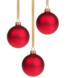 three christmas balls hanging on ribbon isolated on white