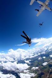 skydiving dive in blue sky