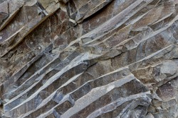 Various rock formation in geological layers in an abandoned quarry