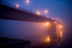 Bridge in the fog by night