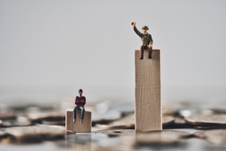 Miniature businessman with disparity society image