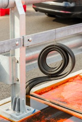 detail of a metal road fence with a rubber gutter during repair