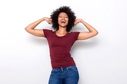 Portrait of healthy young african woman flexing both arms muscles on white background
