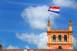 National flag flying above Presidential Palace in Asuncion, Paraguay. It serves as a workplace for the President and the government of Paraguay.