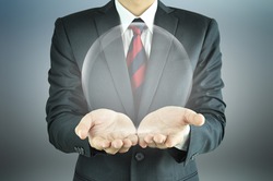 Businessman hands holding empty transparent sphere 