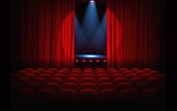 Stage with empty seats and red curtains with bright spotlight