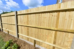 A brand new close boarded fence in the UK in September.