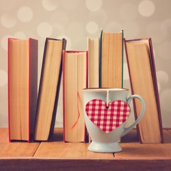 Valentine's day cup with heart shape and books