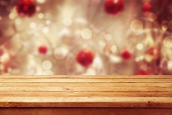 Christmas holiday background with empty wooden deck table over winter bokeh. Ready for product montage