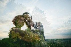 double exposure of couple in love and picturesque forest landscape
