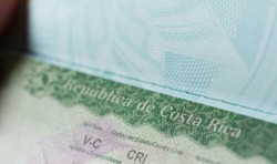 Issued costa rica visa in passport macro close up view. Visa stamp to cross boarder