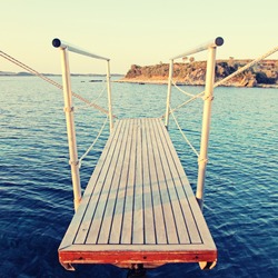 Gangplank of the yacht and sea view on sunset, Greece. Square toned image, instagram effect.