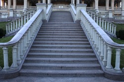 wide view with beautiful classical mansion staircase with balustrade in the park 