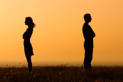 Silhouette of a angry woman and man on each other.Relationship difficulties