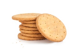 BISCUITS - A stack of delicious wheat round biscuits with a few crumbs isolated on white