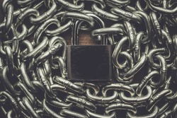 check-lock and chain on wooden background concept