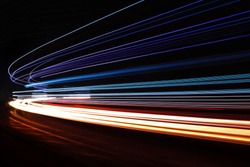 Light trails in tunnel. Art image. Long exposure photo taken in a tunnel.