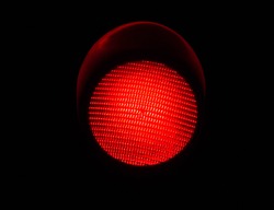 LED Red Light Traffic Light Isolated by a Black Background